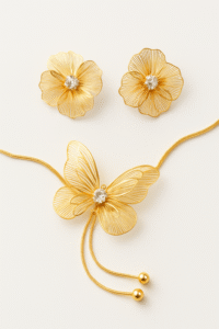 Pearl Petal jewelry set featuring gold glower earrings and matching necklace with a pearl centerpiece. Anti tarnish, elegant set perfect for daily wear.